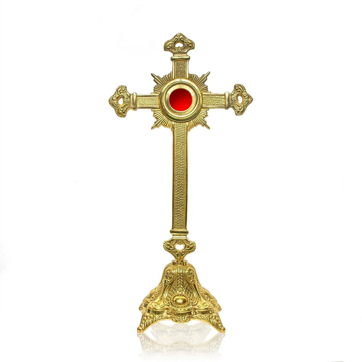 Relicário - cruz - latão, vista frontal com relicário circular vermelho, raios e base ornamentada